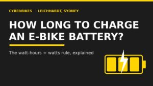 Charcoal and yellow Cyberbikes banner reading How Long To Charge An E-Bike Battery with a battery and lightning bolt icon