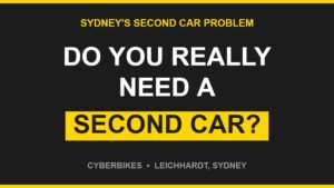 Bold charcoal and Cyber Yellow graphic asking Do You Really Need A Second Car in Sydney, Cyberbikes Leichhardt