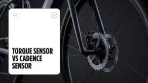 E-bike crank and chainring close-up with the headline Torque Sensor vs Cadence Sensor