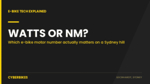 Cyberbikes graphic asking Watts or Nm: which e-bike motor number actually matters on a Sydney hill